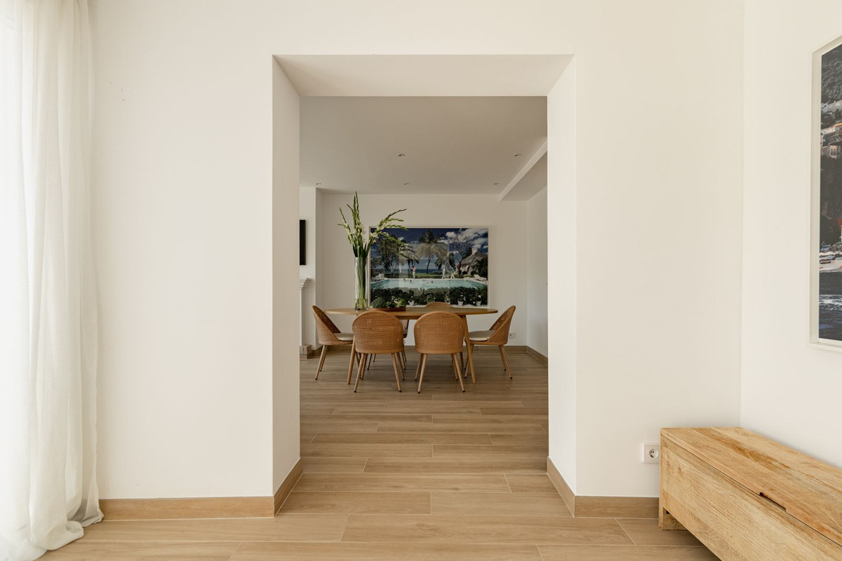 View from the hallway through a doorway toward the dining table