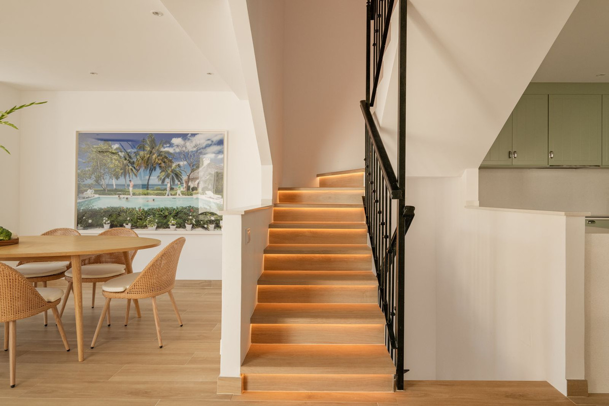 Staircase with warm LED lighting recessed under each tread