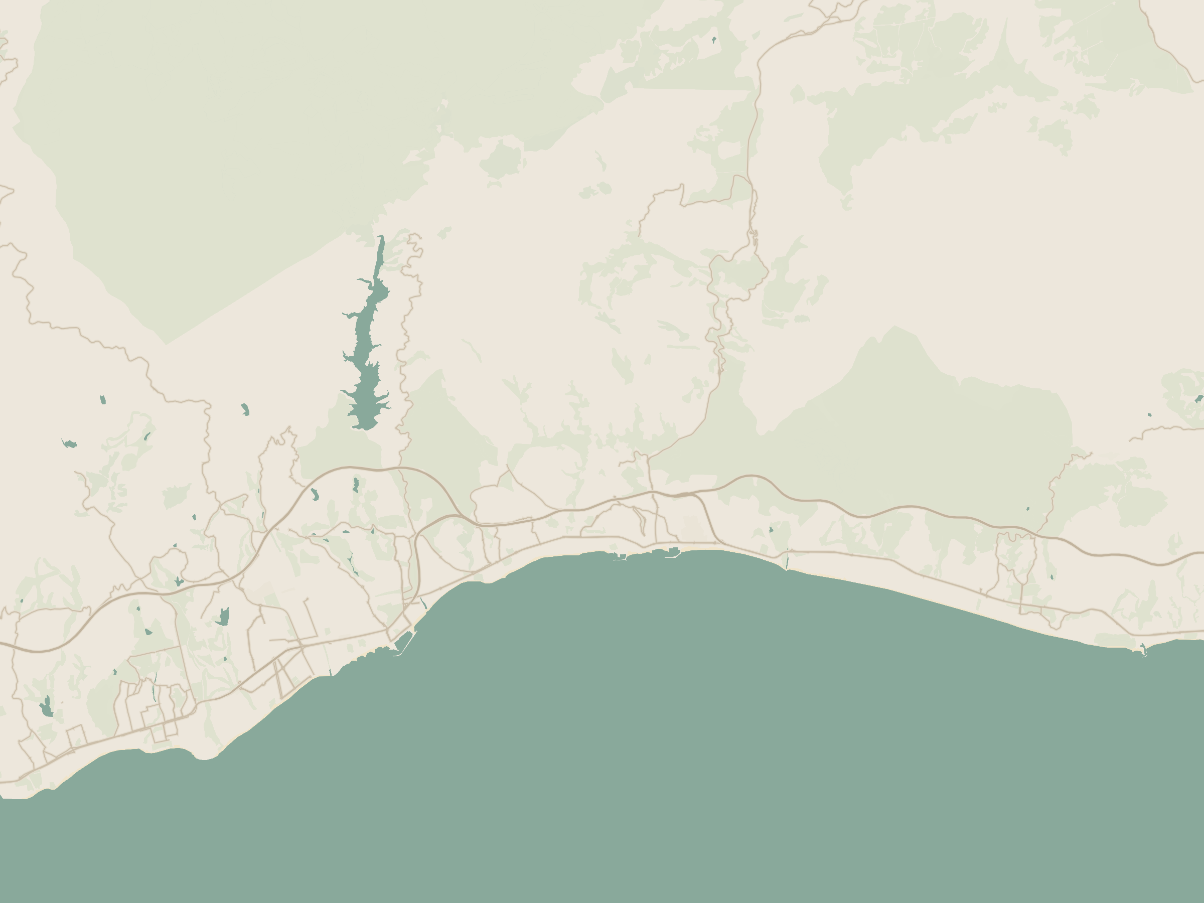 Branded map of the Marbella coast showing Petunias 12 in San Pedro de Alcántara, beachside, with Puerto Banús and Nueva Andalucía to the east, Guadalmina and Estepona to the west, and Málaga Airport to the northeast.